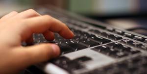 Hand-Laptop-Keyboard-Online